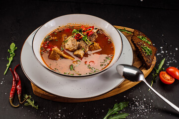 Traditional hungary soup bograch on wooden background
