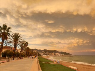 Seafront promenade in Sitges at beautiful sunset, views of the sea