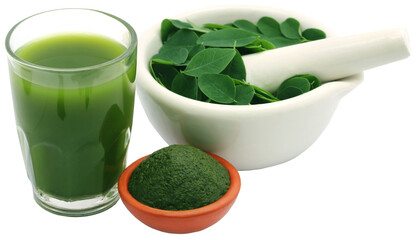 Mashed moringa leaves with extract in a glass