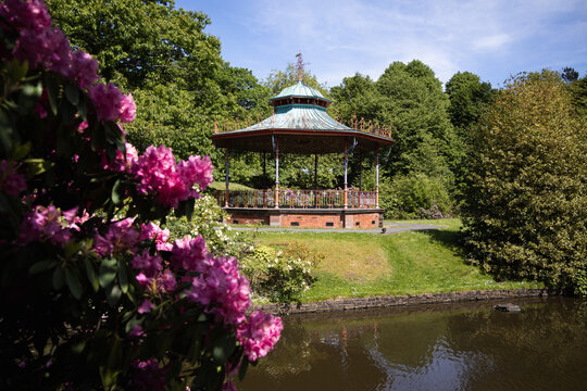 Victorian bandstand with flowers in springtime at Sefton park in Liverpool