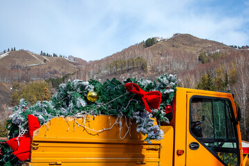 christmas decorations in a pile after the holiday on a yellow truck