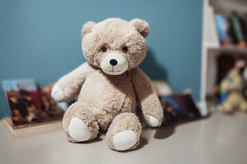 a children's teddy bear sits on a shelf in a children's room, generative AI