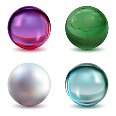 Set of transparent glass magic balls, pearl and green gem on white background
