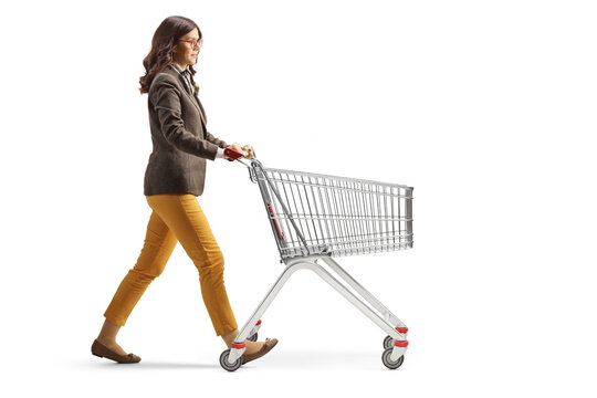 Full Length Profile Shot Of A Young Professional Woman Alking With An Empty Shopping Cart