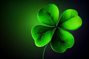 A four-leaf green clover flower as a symbol of good luck for St. Patrick's holiday.