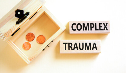 Complex trauma symbol. Concept words Complex trauma on wooden block. Beautiful white table white...