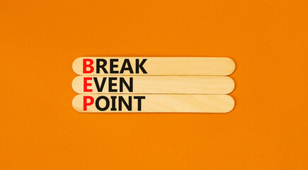 BEP break even point symbol. Concept words BEP break even point on wooden stick on a beautiful...