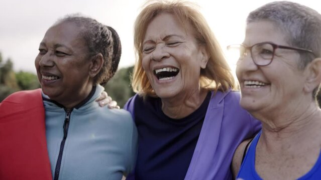 Multiracial sport senior women having fun together after exercise workout outdoor at city park