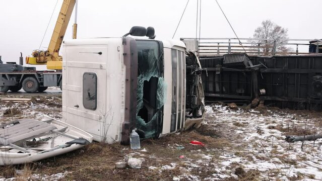 highway road, trailer crashed, truck Cabin. Truck overturned on a highway, awaiting help, concept for insurance companies