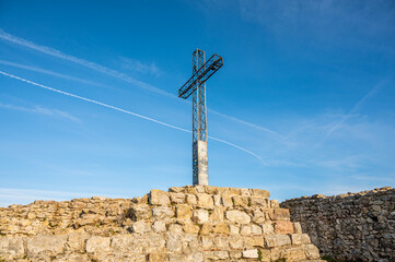 Fototapeta na wymiar The metal cross on the Rocca di Manerba sul Garda