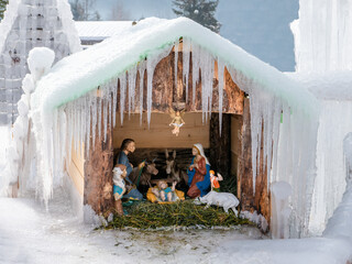 San Pietro di Cadore, Italy - December 12, 2022: Outdoor Christmas nativity scene in ice in San...