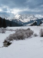 Fototapeta na wymiar Snowy winter landscape in San Pietro di Cadore, Italy