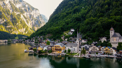 Fototapeta na wymiar Stock Photos and Images of Top view of Hallstatt village, mountains background in Austria