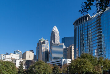 Fototapeta na wymiar Charlotte, Carolina del Norte, Usa. November 23, 2022: City center with blue sky and modern building architecture.
