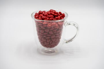 cup of red mini hearts