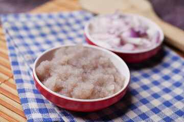 red onion paste in a bowl on table 