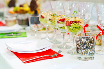original serving of portioned salads on the table. catering.