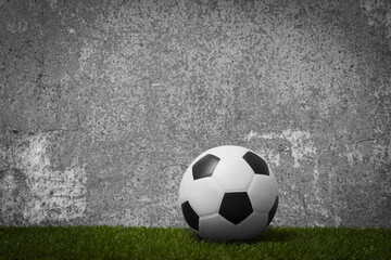 Soccer ball on green grass on grey background. Professional sport concept. Horizontal sport poster, greeting cards, headers, website