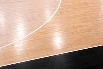 Wooden floor volleyball, basketball, badminton, futsal, handball court with light effect. Wooden floor of sports hall with marking lines line on wooden floor indoor, gym court