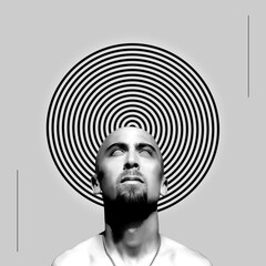 Bearded man looking up on spiral background