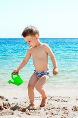 Happy child playing on the sea background