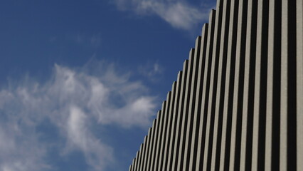 Fototapeta na wymiar metal fence against sky background
