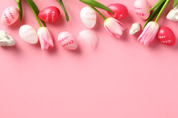 Happy Easter card template. Flat lay tulips, Easter eggs, decorative rabbits on pastel pink background.