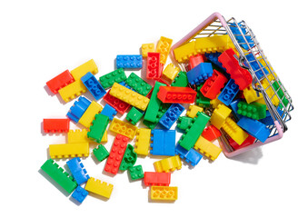 Multi-colored plastic cubes of a children's designer on a white isolated background