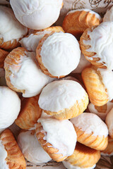 Cupcakes in large quantities. View from above. Baking in the form of cupcakes for the Easter holiday.Vertical photo.