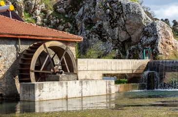 Water mill, mill wheel on the river. In turkey country.