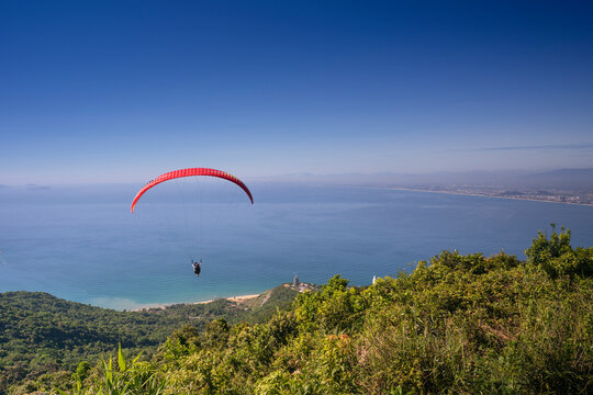 Da Nang city, Quang Nam province, Vietnam - June 25, 2017: flying paragliding on top of Son Tra Mountain. This is a regular activity of parachute flying club