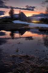 Mount Sass de Stria reflecting in a pond at sunset in Cortina d'Ampezzo, Italy