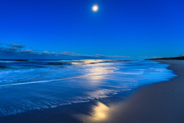 Beautiful Baltic sea beach on the Hel Peninsula with the full moon. Poland - obrazy, fototapety, plakaty