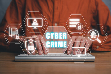 Cyber crime concept, Person hand typing on keyboard computer with cyber crime icon on virtual...