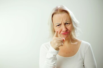 woman swears and shakes her head no throws up hands, screams loudly, feels stress, irritation and anger isolated on white background