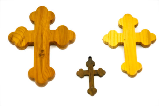 Wooden cross on white background