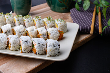 California sushi roll, Japanese traditional dishes combine with American ingredients. selective focus