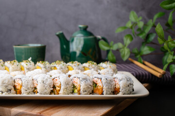 California sushi roll, Japanese traditional dishes combine with American ingredients. selective focus