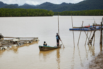 Fisherman in fishing boat 
