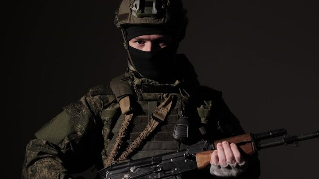 Portrait of Ukrainian Soldier reload weapons. Ukrainian