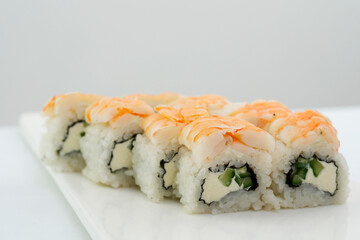 Shrimp sushi, red fish, tuna, large Japanese rolls, chopsticks. sushi with shrimp High quality photo