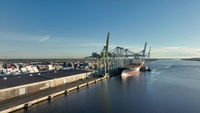 Aerial view of a cargo ship getting loaded with ship containers at the Port of Jacksonville.