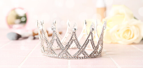 Beautiful tiara on light pink background. Prom concept © Pixel-Shot