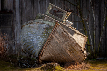Old Weathered Abandoned Salmon Fishing Boat. Left to rot next to an old cannery building on the Semiahmoo Spit near Blaine, Washington.