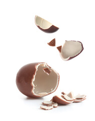 Broken chocolate Easter egg on white background