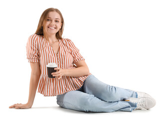 Beautiful girl with cup of coffee sitting on white background