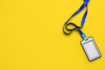 Blank badge with blue lanyard on yellow background