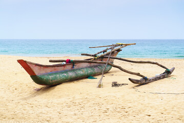 Fishing boat on the sand near the ocean
