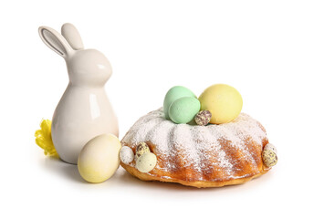Tasty Easter cake, eggs and ceramic bunny isolated on white background