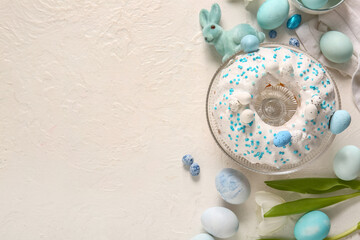 Composition with tasty Easter cake, eggs and tulip flower on light background